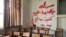 A classroom at Ferdowsi University with graffiti expressing opposition to the execution of anti-government protesters.