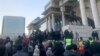 Акция протеста у Дворца правительства Монголии. Демонстранты требовали раскрыть имена подозреваемых в коррупционных сделках чиновников. Монголия. Улан-Батор, 5 декабря 2022 года 