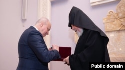 Armenia - Russian Ambassador Sergei Kopyrkin presents Catholicos Garegin II with the Russian Order of Honor, January 11, 2023.