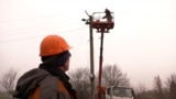 Utility crew working to restore power near the village of Makarove in Kharkiv region