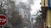 Smoke rises from the building of a Kabul hotel, which was attacked on December 12. 