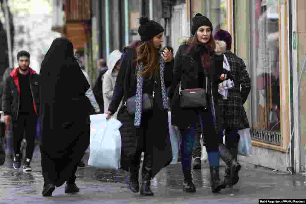 Women in Tehran on December 6.&nbsp; In some cities outside of Tehran however, restrictions on clothing apparently remain in full force.&nbsp;