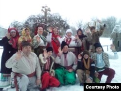 Vira Bezzubenko (top right) takes part in Christmas festivities with locals from the village of Selische in the Vinnytsya region.