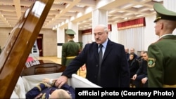 Alyaksandr Lukashenka pays his respects at Uladzimir Makey's funeral in Minsk on November 29. 