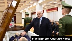 Alyaksandr Lukashenka pays his respects at Uladzimir Makey's funeral in Minsk on November 29.