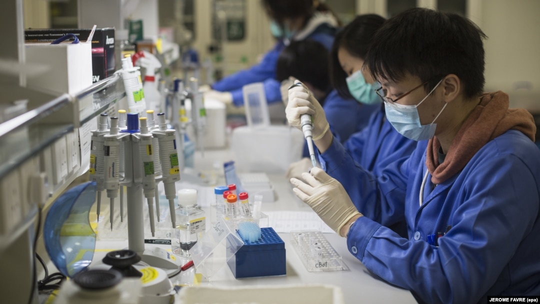 Lab technicians work at a BGI Group facility in Hong Kong.