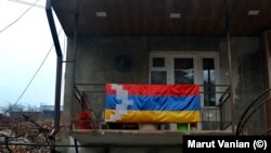 A Karabakh flag displayed on a balcony in Stepanakert, December 19, 2022.
