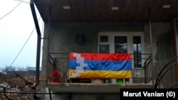 Nagorno-Karabakh - A Karabakh flag on a balcony in Stepanakert, December 20, 2022.