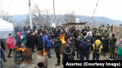 Azerbaijanis block the road connecting Nagorno-Karabakh to Armenia.