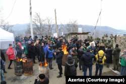 Azerbaijanis block the road connecting Nagorno-Karabakh to Armenia.