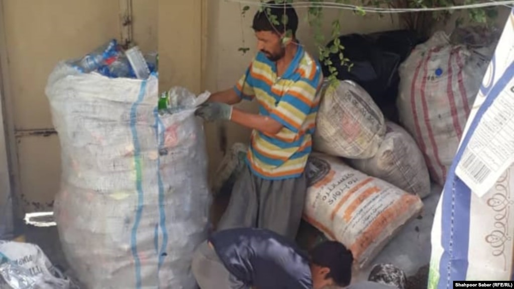 Former Afghan special forces commander Sayed Ahmad Nouri collecting garbage in Iran.