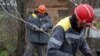 Workers repair broken power lines damaged by shelling in Ukraine's Donetsk region on November 25. 
