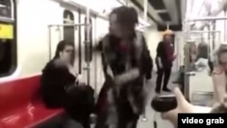 A young woman has defied Iranian law by dancing wildly on a subway train without her hijab covering her hair.