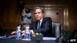 U.S. - Secretary of State Antony Blinken gathers papers after a Senate Senate Foreign Relations Committee hearing in Washington, DC, on April 26, 2022.