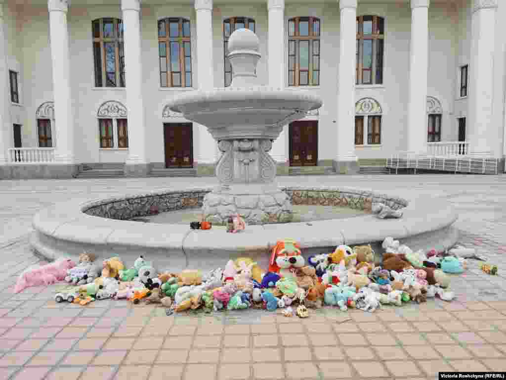 An impromptu memorial for children who have died during the war in front of the Palace of Culture in the town of Nova Kakhovka in the Kherson region. &quot;This building is opposite the Russian commandant&#39;s office,&quot; said one man as he walked by. &quot;They bring toys here so that they can see and remember.&quot;&nbsp;