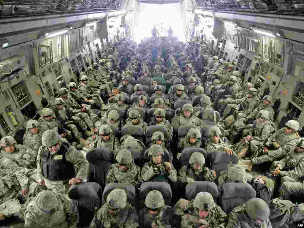 U.S. soldiers arrived from Afghanistan sit inside a plane at the U.S. airbase 30 km outside Bishkek in Manas on February 26, 2009. The soldiers who had been serving with ISAF forces in Afghanistan made a layover on their way to Germany. The United States is still holding out hope for a deal with Kyrgyzstan to avoid the closure of the U.S. military supply base there for Afghanistan even after the Kyrgyz president formalized the shutdown.