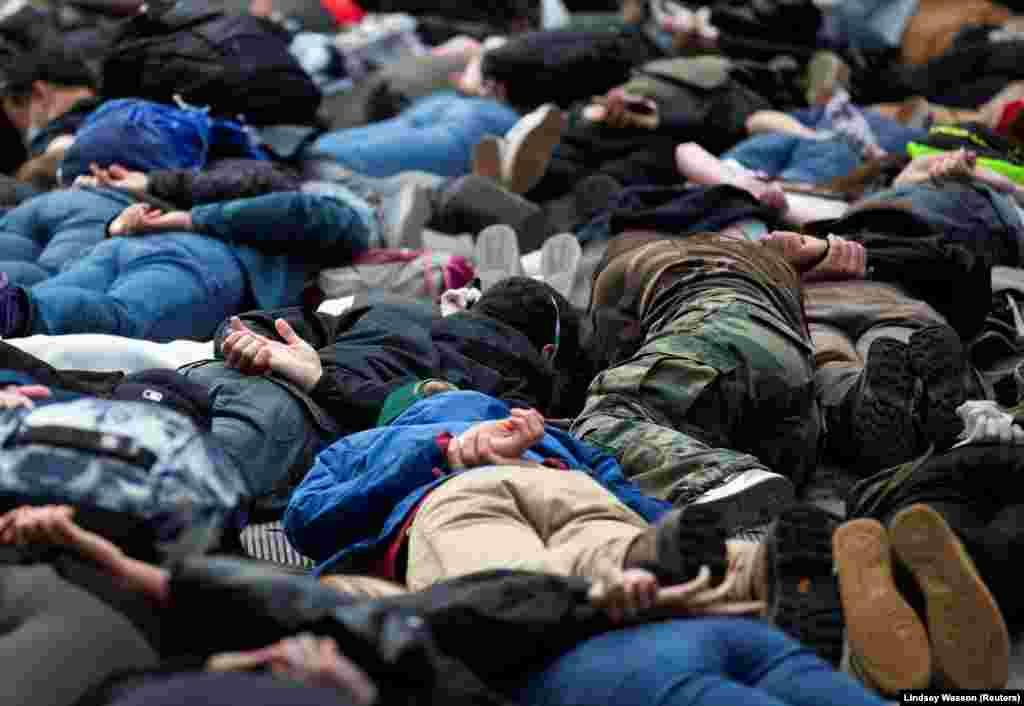 Protesters lie down for a minute of silence in the position George Floyd was in when he died during a rally against police brutality and the death in Minneapolis police custody of George Floyd, in Seattle, Washington, U.S. June 2, 2020. REUTERS/Lindsey Wasson