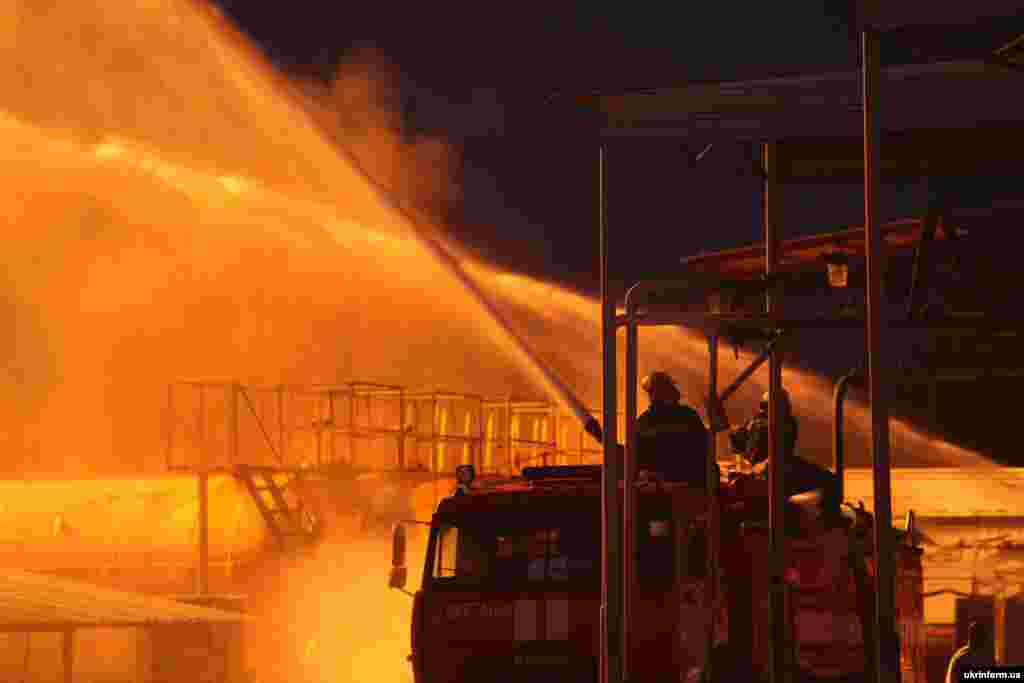 Firefighters try to split the fire overnight on June 8-9.