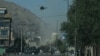 Smoke and dust rise following an air strike from an Afghan military helicopter during clashes between security forces and militants near the Eid Gah Mosque in Kabul last month.