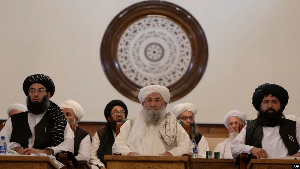 The Taliban’s Prime Minister Mohammad Hassan Akhund (center) and Minister for Promotion of Virtue and Prevention of Vice Sheikh Mohammad Khalid (left) attend a gathering at the former presidential palace in Kabul in 2022.