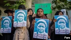 Protesters in Tehran holding portraits of Sheik Ibrahim Yaqoub El Zakzaky, a fire-brand Shiite cleric jailed in Nigerisa. July 17, 2019