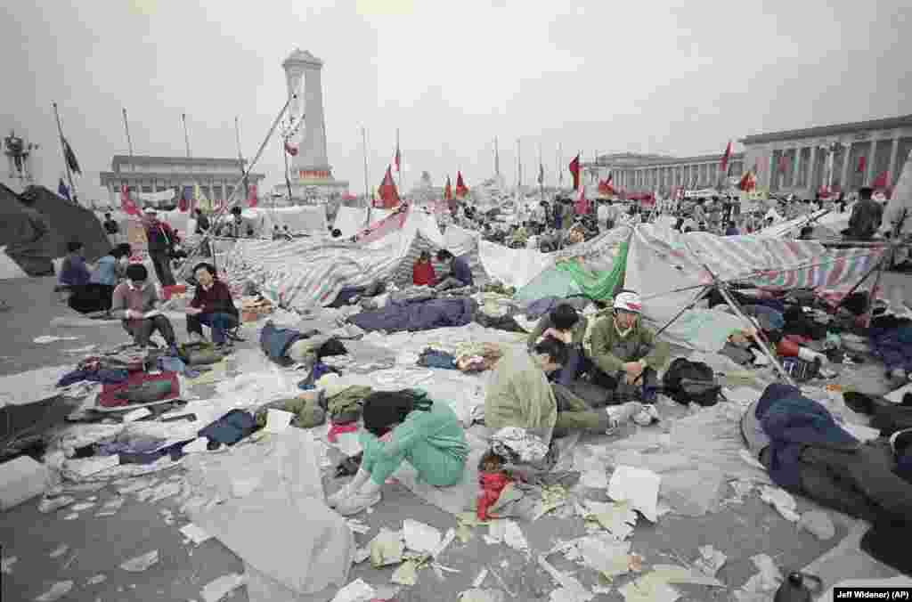 file -- Tiananmen Square Protests 1989 -- Students rest in the litter of Tiananmen Square, May 28, 1989, in Beijing, as their strike for government reform enters its third week. (AP Photo/Jeff Widener)