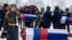 Cossacks carry coffins containing the remains of Russian and French soldiers during a burial ceremony in the town of Vyazma, west of Moscow, on February 13. 