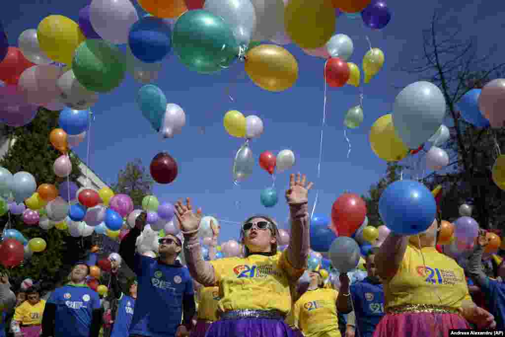 Young people with Down syndrome release balloons during celebrations marking World Down Syndrome Day in Bucharest, Romania.