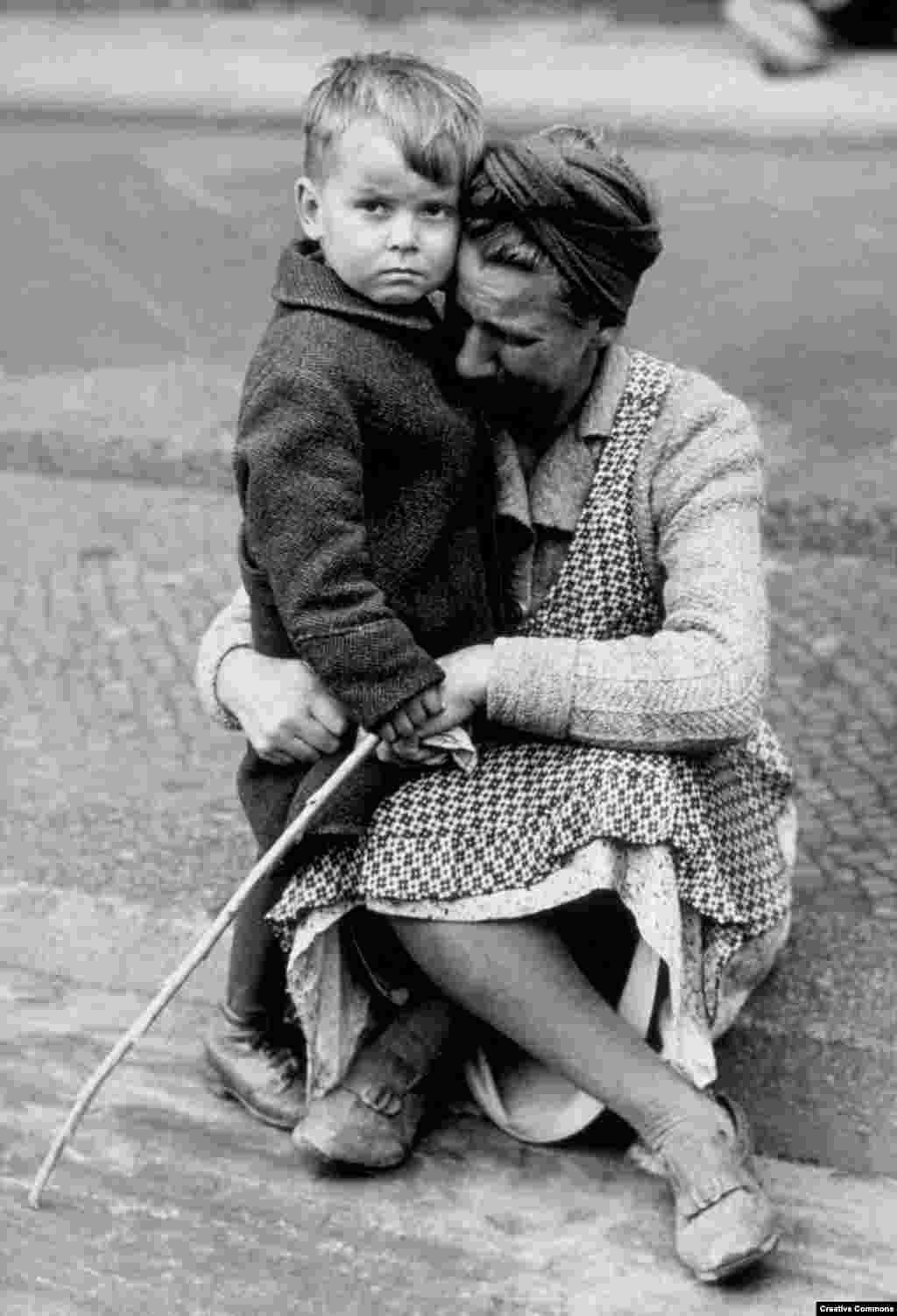 A German mother with her son after discovering her Berlin house was destroyed during the war in January 1945.&nbsp;
