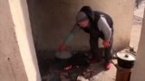 Bombs, Basements, And Burials: Besieged Mariupol Residents Struggle To Survive video grab 2