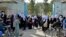 Girls leave their school following an order to close just hours after reopening in Kabul on March 23.