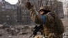 A Ukrainian soldier takes up a position in Mariupol.