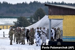 Ukrainian service members train with U.S. Army instructors near Lviv on February 4.