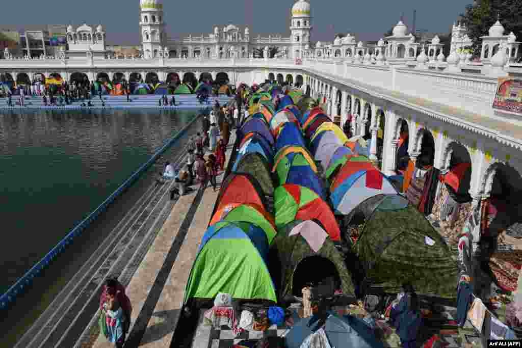 Sikh pilgrims gather at the holy sarovar -- or sacred pool -- on the occasion of the birth anniversary of Guru Nanak Dev, the founder of Sikhism, in Nankana Sahib, Pakistan.