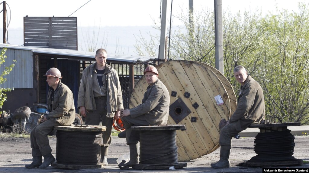 Miners rest at the Skhidkarbon coal mine following a suspected methane explosion in the Luhansk region on April 26.