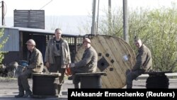 Miners rest at the Skhidkarbon coal mine following a suspected methane explosion in the Luhansk region on April 26.