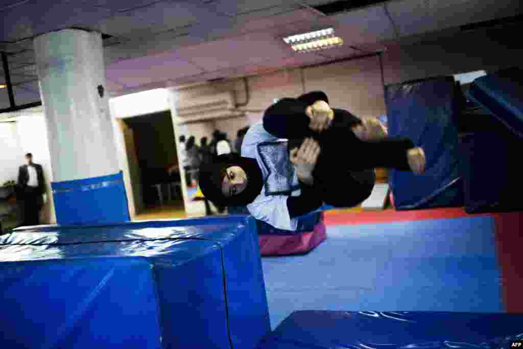 Maryam Rad, a parkour trainer, jumps during a session at a sports hall in northern Tehran.