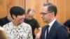 German Foreign Minister Heiko Maas, right, talks to Norwegian Foreign Minister Ine Eriken Soereide at the beginning of the conference on the lake chad region in Berlin Monday, Sept. 3, 2018. (Bernd von Jutrczenka/dpa via AP)