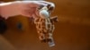 The giraffe keychain that has become an important reminder of home for the Pavlenko family ever since they fled the war in Ukraine. 