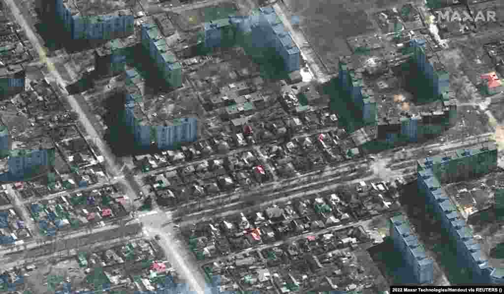 Tanks take up positions in a residential area of Mariupol.