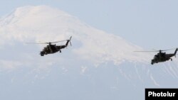 Armenia - Military helicopters fly against the backdrop of Mount Ararat, May 26, 2016.