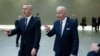 NATO Secretary-General Jens Stoltenberg (left) walks with U.S. President Joe Biden at an extraordinary summit at NATO headquarters in Brussels on March 24.