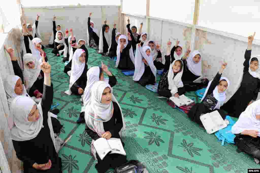 Afghan girls attend a class at their primary school in Kandahar on March 23.&nbsp;