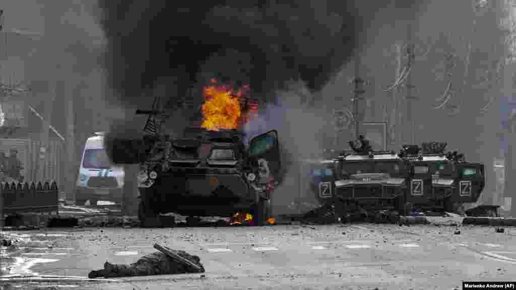 Russia Ukraine War One Month Photo Gallery A Russian armored personnel carrier burns amid damaged and abandoned light utility vehicles after fighting in Kharkiv, Ukraine, Sunday, Feb. 27, 2022. 