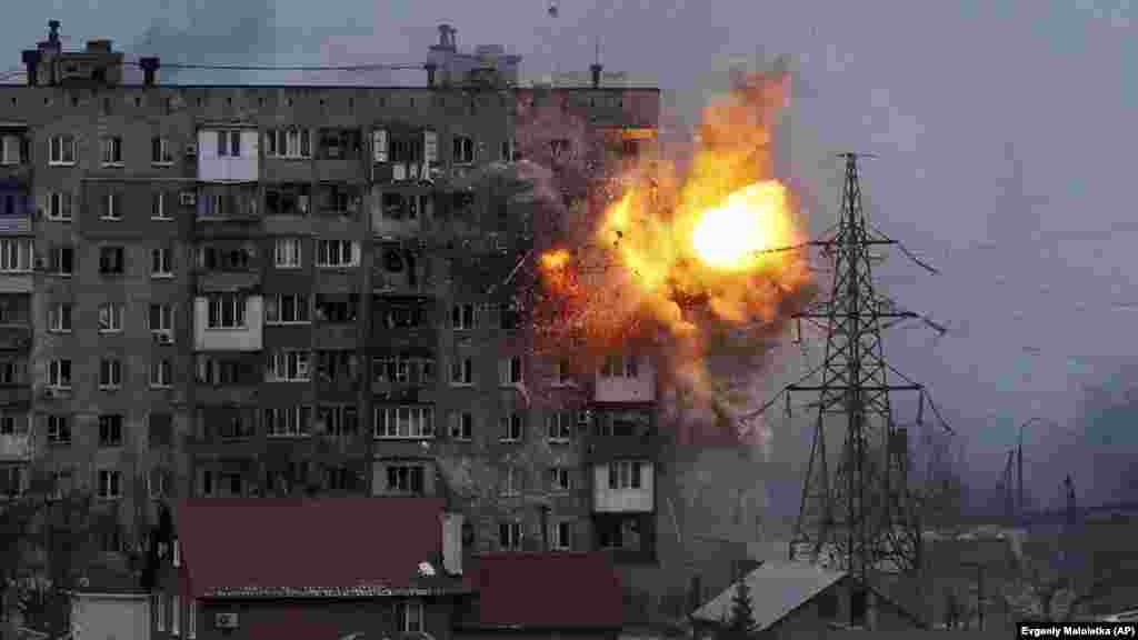 Ukraine -- An apartment building explodes after a Russian army tank fires in Mariupol