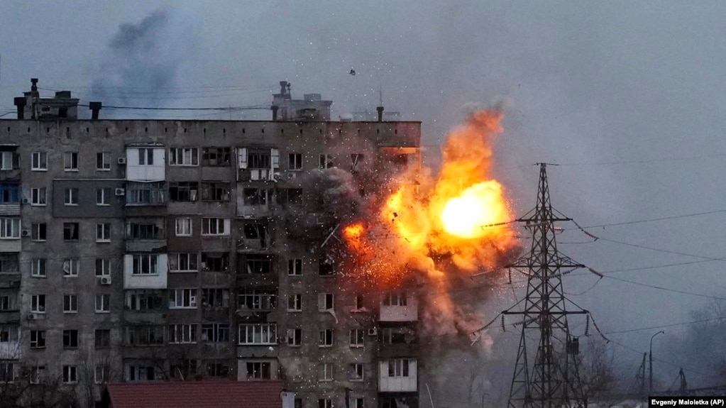Ukraine -- An apartment building explodes after a Russian army tank fires in Mariupol