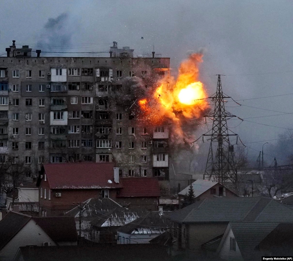 An apartment building explodes after being hit by a shell from a Russian tank in Mariupol on March 11.&nbsp;