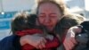 Women from Kharkiv are reunited with a friend from Chernihiv after fleeing to Romania following Russia's invasion of Ukraine, at the border crossing in Siret, Romania, on March 22.