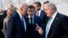 U.S. President Joe Biden (left) talks with French President Emmanuel Macron (center) and Britain's Prime Minister Boris Johnson ahead of an extraordinary NATO summit in Brussels on March 24.