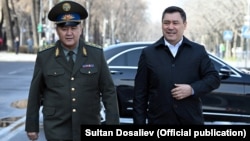 Kyrgyz President Sadyr Japarov (right) and national-security chief Kamchybek Tashiev (file photo)